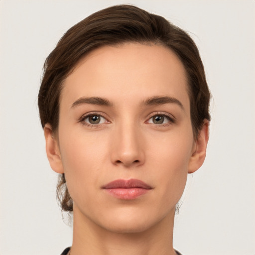 Neutral white young-adult female with short  brown hair and brown eyes