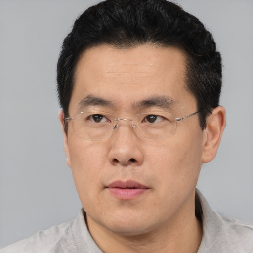 Neutral asian adult male with short  black hair and brown eyes