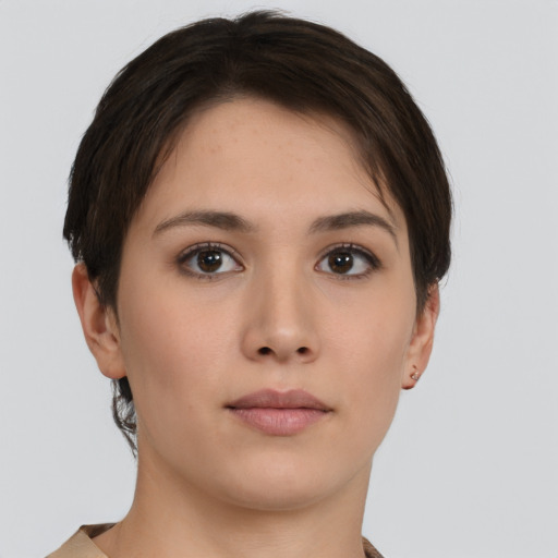 Neutral white young-adult female with short  brown hair and brown eyes