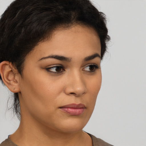 Neutral latino young-adult female with short  brown hair and brown eyes