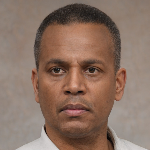 Neutral latino adult male with short  black hair and brown eyes