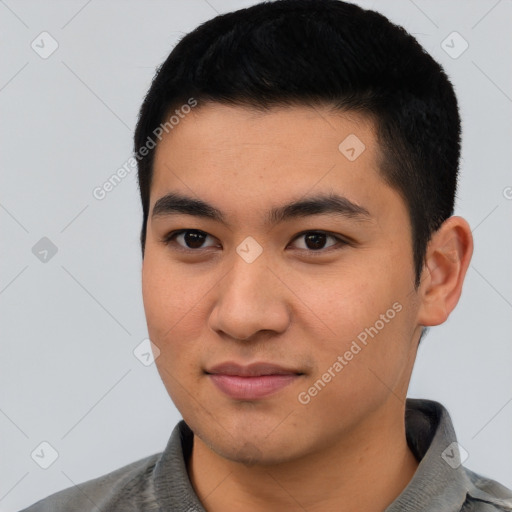 Joyful asian young-adult male with short  black hair and brown eyes