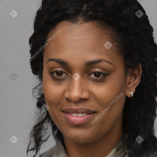 Joyful black young-adult female with long  brown hair and brown eyes