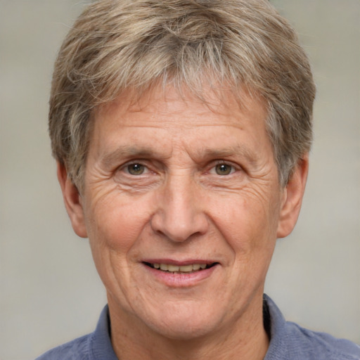 Joyful white middle-aged male with short  brown hair and brown eyes