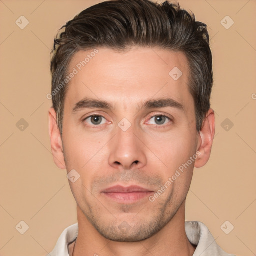 Joyful white young-adult male with short  brown hair and brown eyes