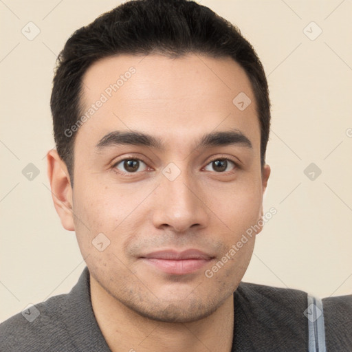 Joyful white young-adult male with short  black hair and brown eyes