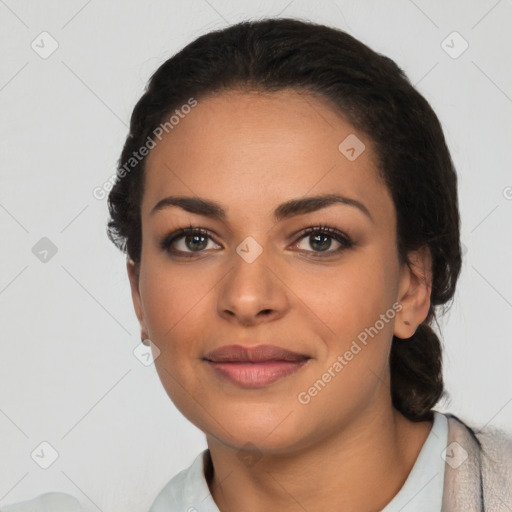 Joyful latino young-adult female with short  black hair and brown eyes