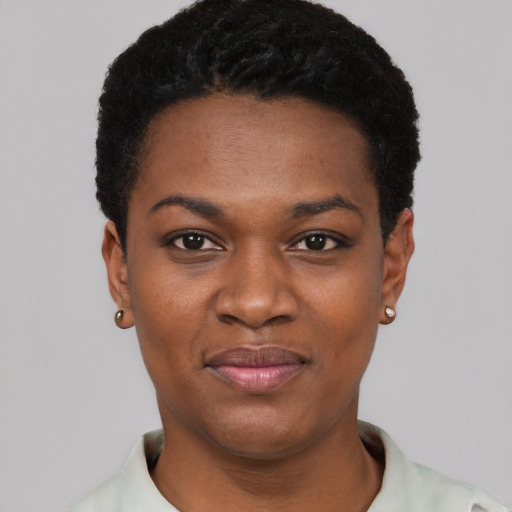 Joyful black young-adult female with short  black hair and brown eyes