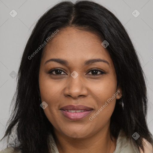 Joyful black young-adult female with long  brown hair and brown eyes