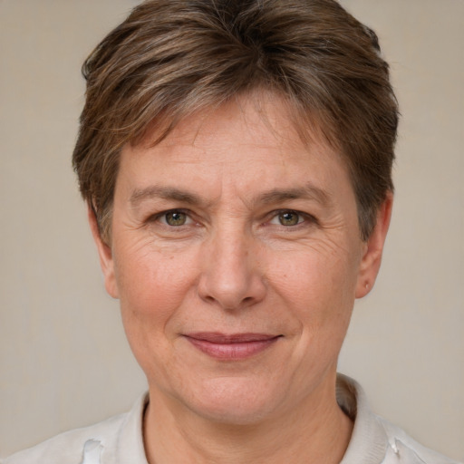 Joyful white adult female with short  brown hair and brown eyes