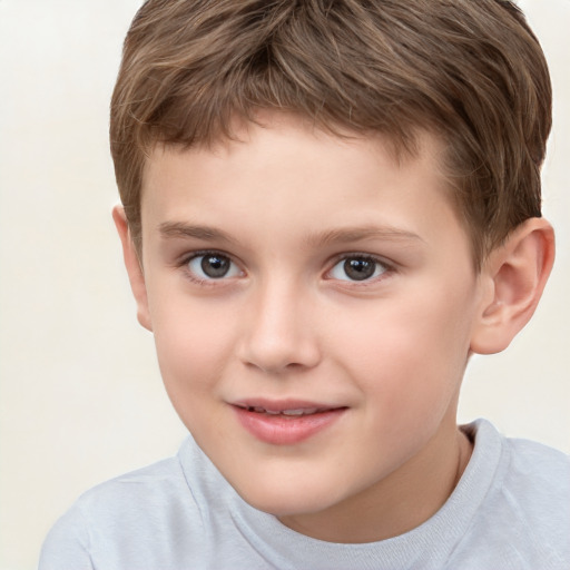 Joyful white child male with short  brown hair and brown eyes