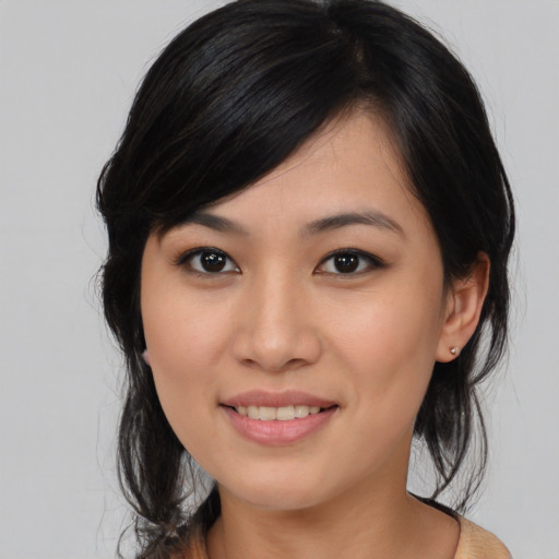 Joyful asian young-adult female with medium  black hair and brown eyes