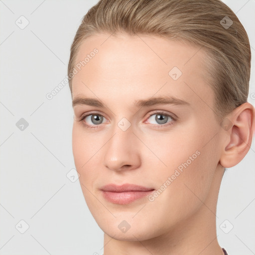 Joyful white young-adult female with short  brown hair and grey eyes