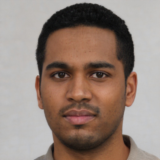 Neutral black young-adult male with short  black hair and brown eyes