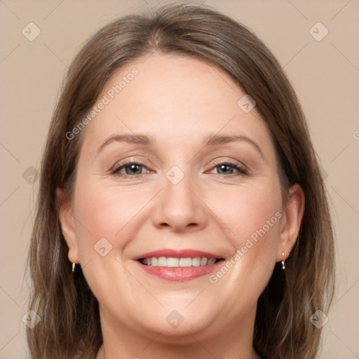 Joyful white adult female with medium  brown hair and grey eyes