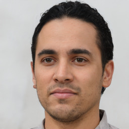 Neutral latino young-adult male with short  black hair and brown eyes