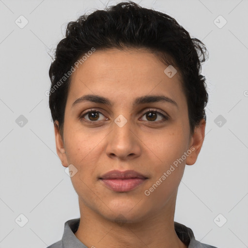 Joyful latino young-adult female with short  brown hair and brown eyes