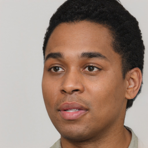 Neutral black young-adult male with short  black hair and brown eyes