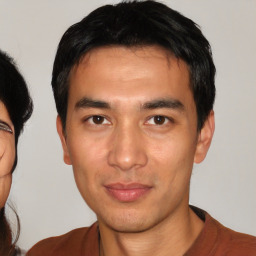 Neutral white young-adult male with short  black hair and brown eyes