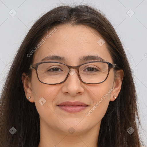 Joyful white adult female with long  brown hair and brown eyes