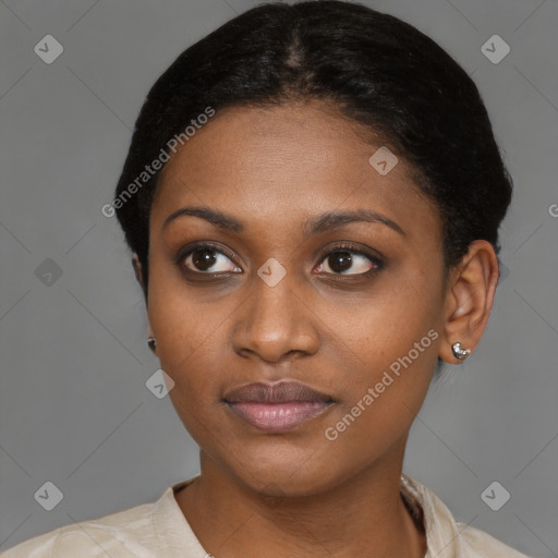 Joyful black young-adult female with short  brown hair and brown eyes