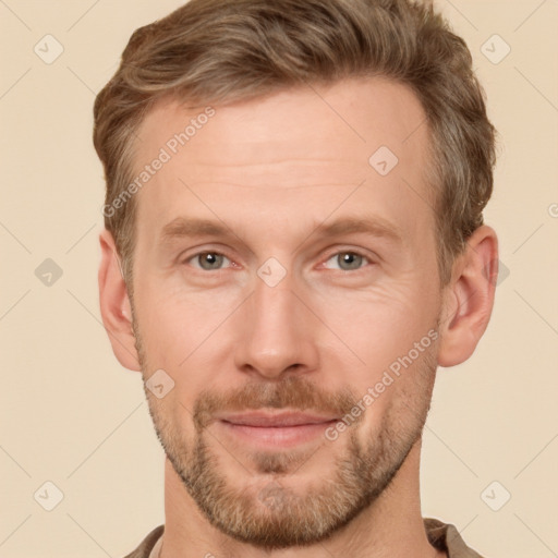 Joyful white adult male with short  brown hair and brown eyes