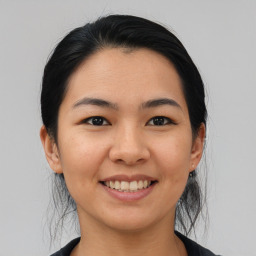 Joyful asian young-adult female with medium  black hair and brown eyes