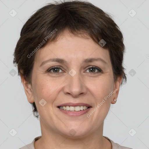 Joyful white adult female with short  brown hair and brown eyes