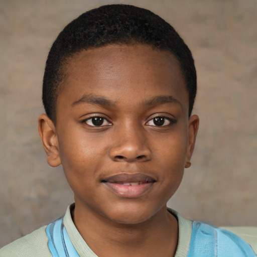Joyful black child male with short  brown hair and brown eyes