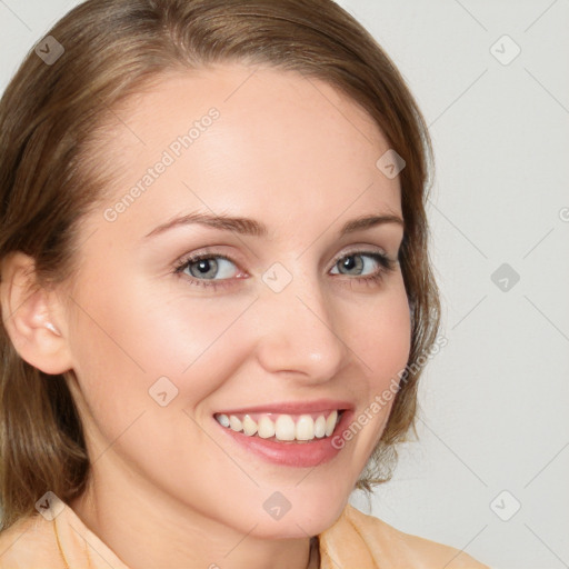 Joyful white young-adult female with medium  brown hair and blue eyes