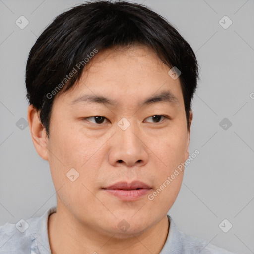 Neutral asian young-adult male with short  brown hair and brown eyes