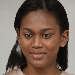 Joyful black young-adult female with medium  brown hair and brown eyes