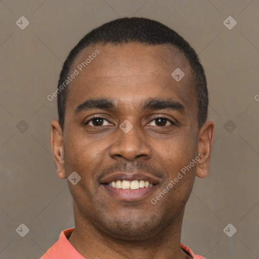 Joyful latino young-adult male with short  brown hair and brown eyes