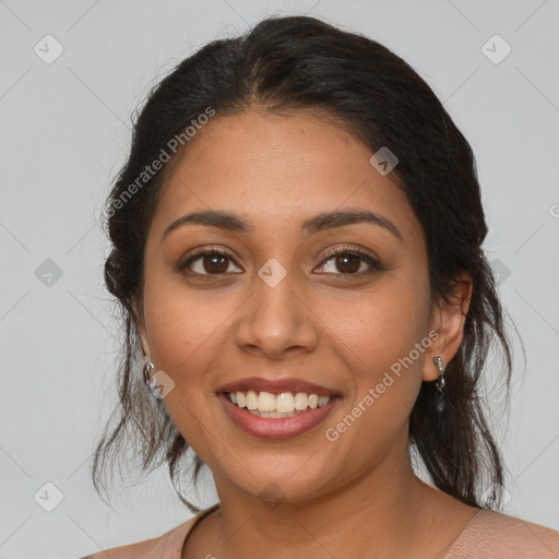 Joyful latino young-adult female with medium  brown hair and brown eyes