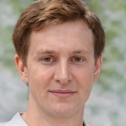 Joyful white adult male with short  brown hair and grey eyes