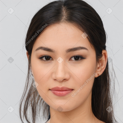 Joyful asian young-adult female with long  brown hair and brown eyes