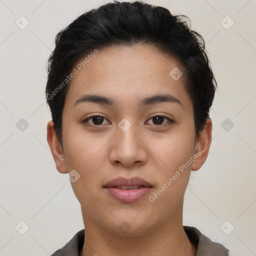 Joyful latino young-adult female with short  black hair and brown eyes