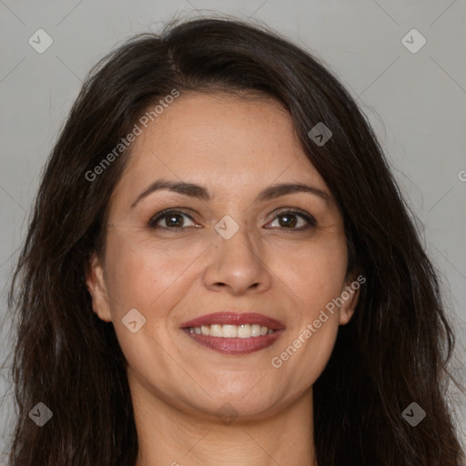 Joyful white adult female with long  brown hair and brown eyes