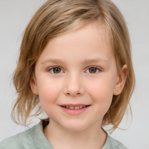 Joyful white child female with medium  brown hair and blue eyes