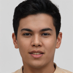 Joyful asian young-adult male with short  brown hair and brown eyes