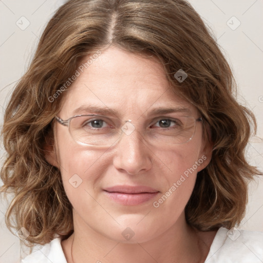 Joyful white adult female with medium  brown hair and blue eyes