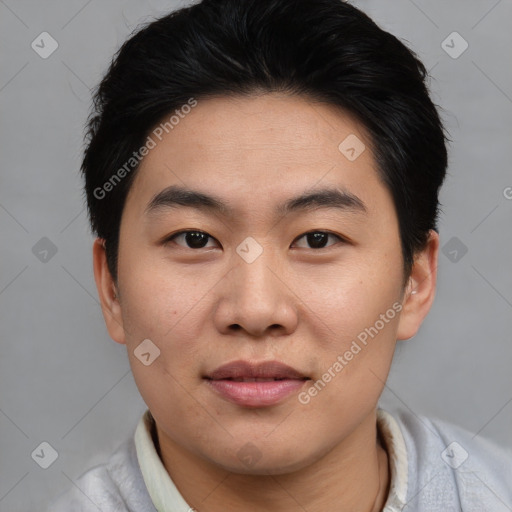 Joyful asian young-adult male with short  brown hair and brown eyes