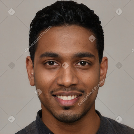 Joyful black young-adult male with short  black hair and brown eyes