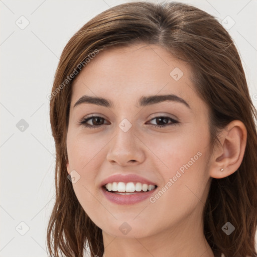 Joyful white young-adult female with long  brown hair and grey eyes