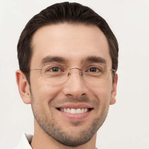 Joyful white adult male with short  brown hair and brown eyes