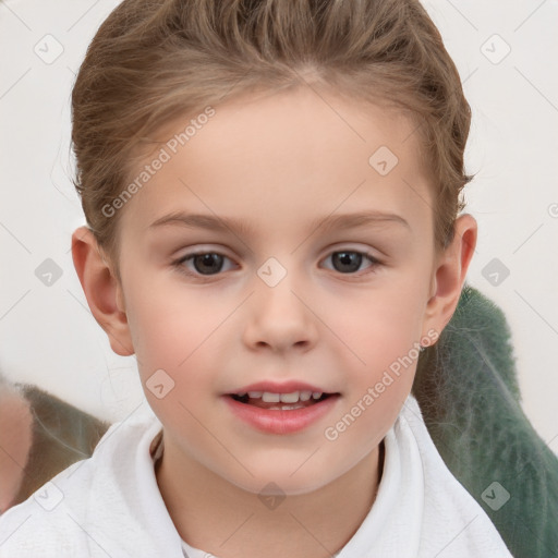 Joyful white child female with short  brown hair and brown eyes