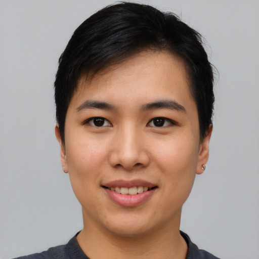 Joyful asian young-adult female with short  black hair and brown eyes