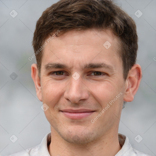 Joyful white adult male with short  brown hair and grey eyes