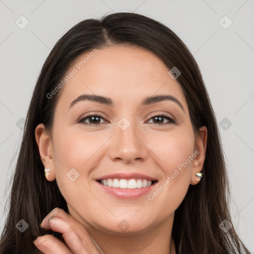 Joyful white young-adult female with long  brown hair and brown eyes