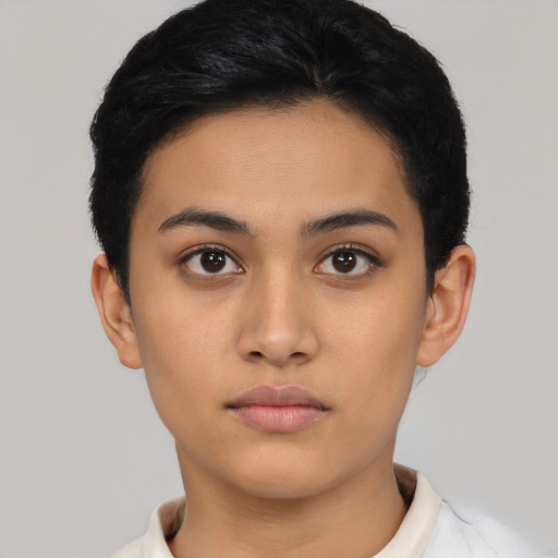 Neutral latino young-adult female with short  black hair and brown eyes